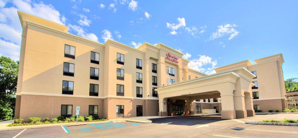 a rendering of a hotel with a building at Hampton Inn and Suites Parsippany/North in Parsippany