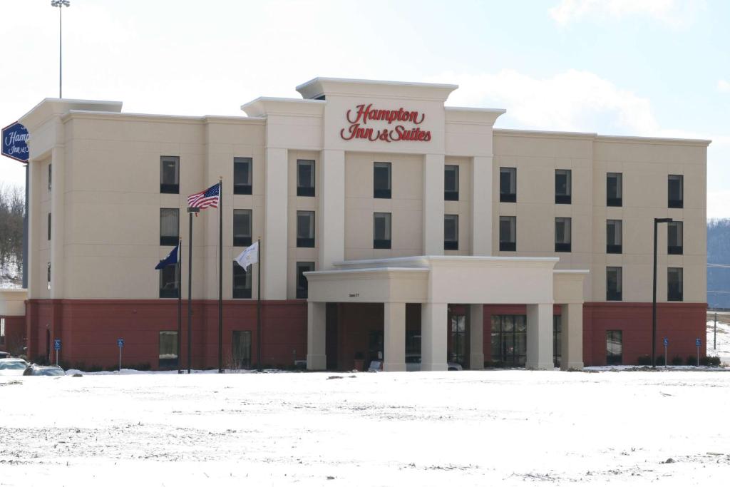 a large white building with a christmas sign on it at Hampton Inn & Suites Wilder in Wilder