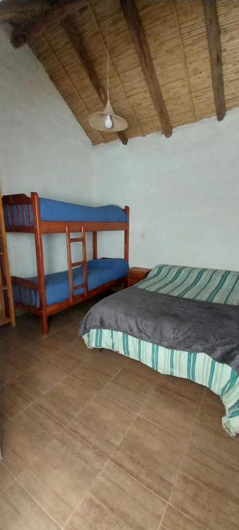Postel nebo postele na pokoji v ubytování Cabañitas EL REPOSO HUMAHUACA