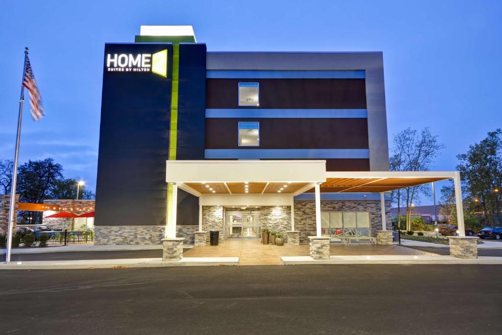 a home healthcare building with a gas station at Home2 Suites By Hilton Maumee Toledo in Maumee