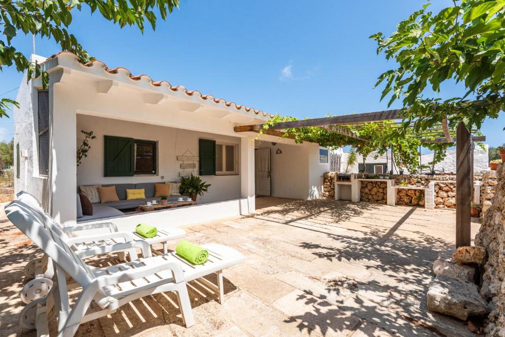 a villa with a view of the patio at Casita Estancia d'en Carretero- Biniarroca in Es Castell