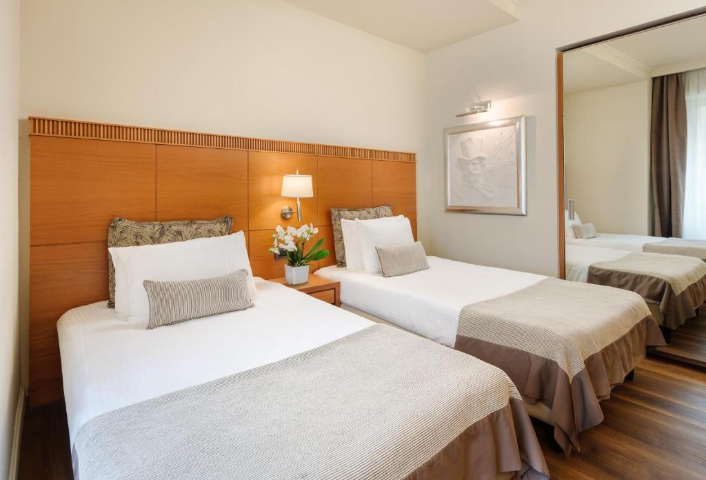 Postel nebo postele na pokoji v ubytování Hotel Dei Cavalieri Milano Duomo