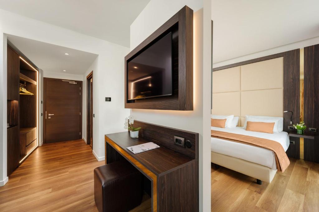 Postel nebo postele na pokoji v ubytování Hotel Dei Cavalieri Milano Duomo