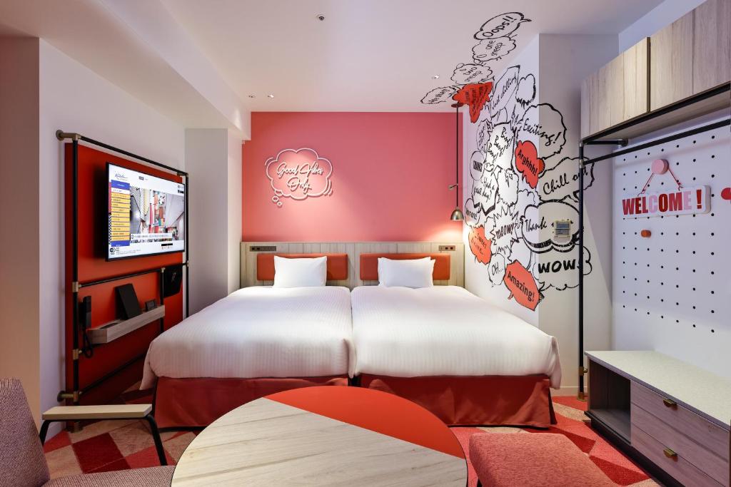 Postel nebo postele na pokoji v ubytování Hotel Kintetsu Universal City