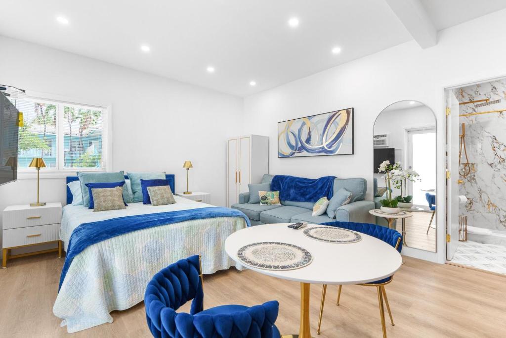 a bedroom with a bed and a table and chairs at 316 Seascape Unit 2 in Hollywood