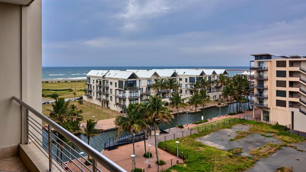 a view of the ocean from the balcony of a condo at 2 Sleeper SEA VIEWS Apartment -- Near MSC Cruise Terminal in Durban