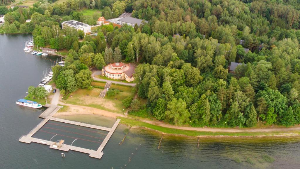 an aerial view of a house on an island in the water at Centralny Ośrodek Sportu - Giżycko in Giżycko