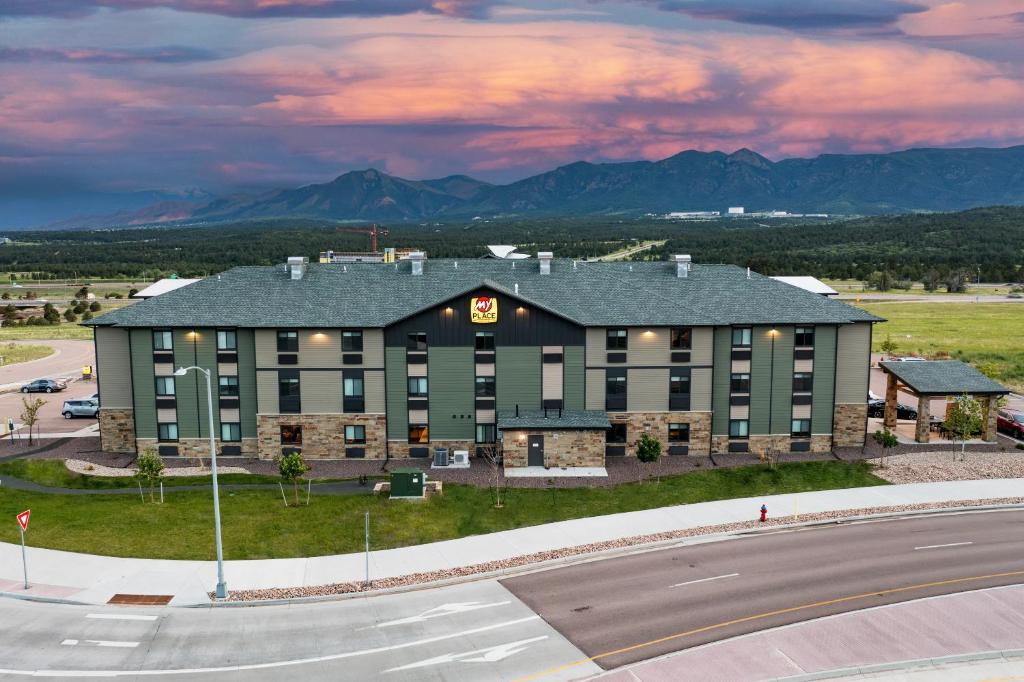 an aerial view of a hotel with mountains in the background at My Place Hotel-Colorado Springs,CO in Colorado Springs