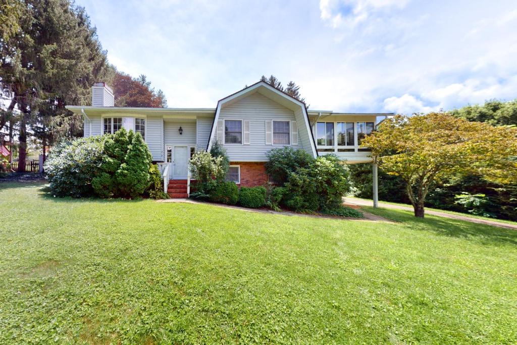 a house with a large lawn in front of it at Dutch Treat in Lake Junaluska
