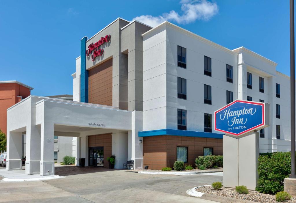 a hotel with a sign in front of it at Hampton Inn Norfolk in Norfolk