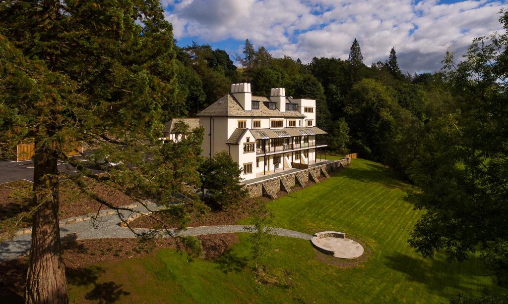 an aerial view of a large house in the woods at Mulberry At Applethwaite Hall in Windermere