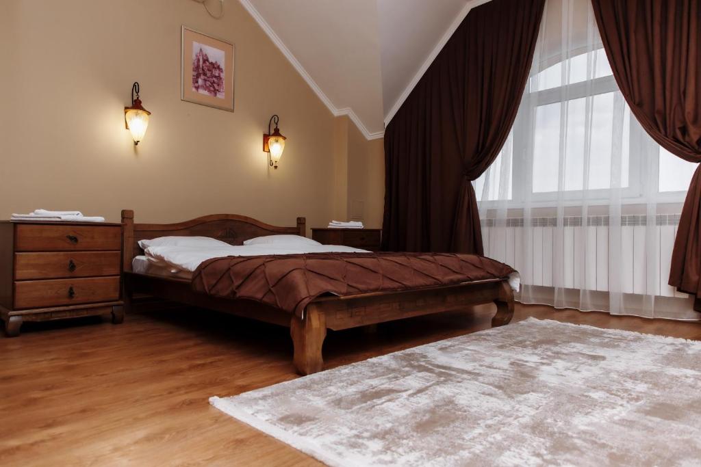 Postel nebo postele na pokoji v ubytování Готель Близниці