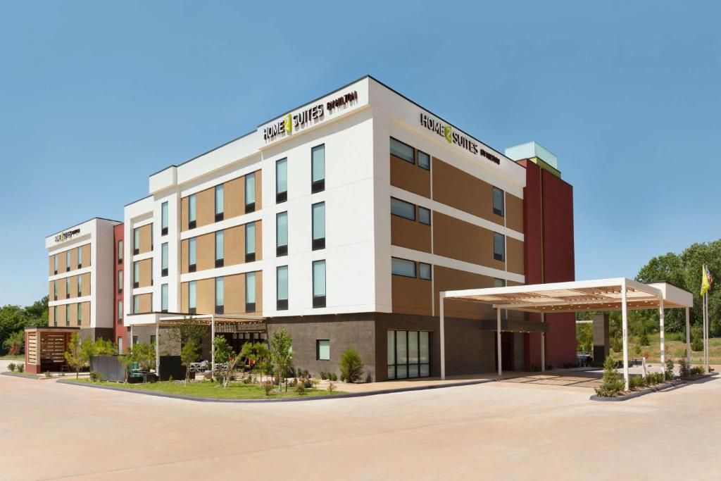 a rendering of the front of the hotel at Home2 Suites by Hilton Edmond in Edmond