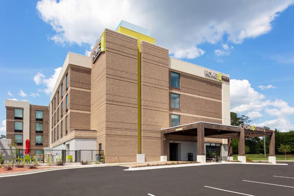 a rendering of a hotel with a parking lot at Home2 Suites By Hilton Valdosta, Ga in Valdosta