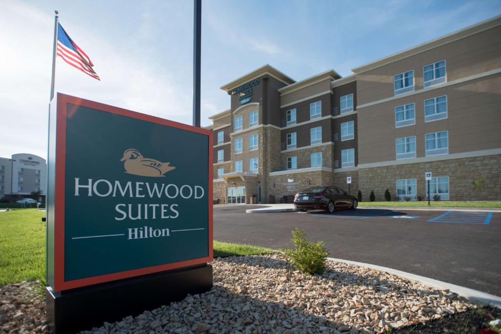 a sign for a honeywood suites hotel in front of a building at Homewood Suites By Hilton Paducah in Paducah
