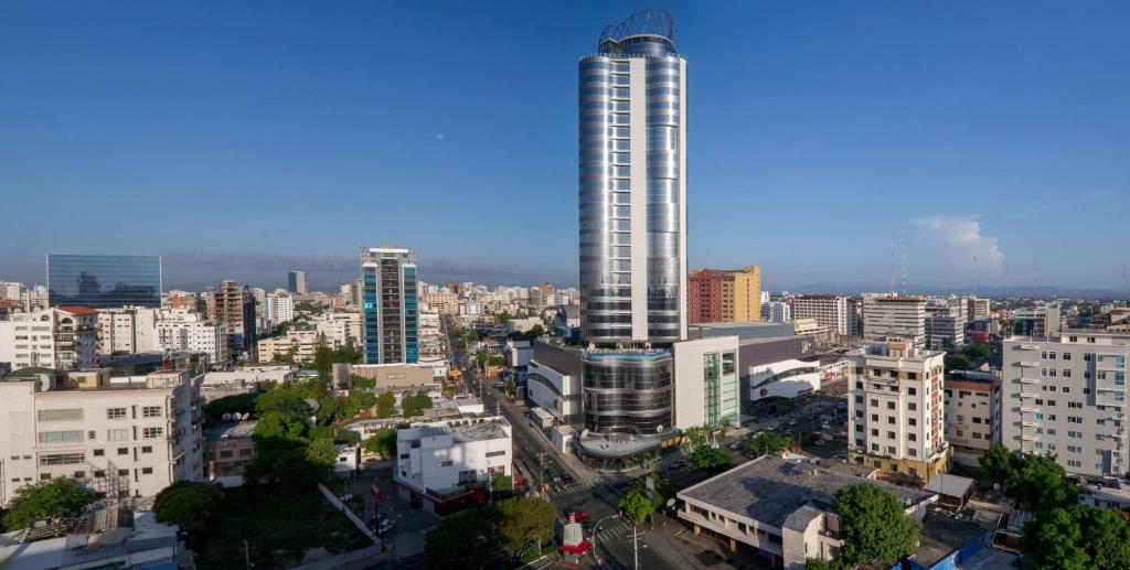 a view of a city with a tall building at Embassy Suites by Hilton Santo Domingo in Santo Domingo