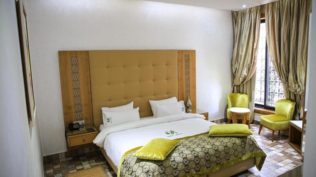 Postel nebo postele na pokoji v ubytování Aralia Boutique Hôtel