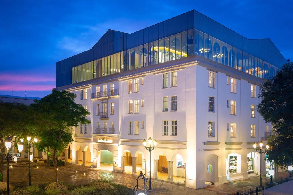a large white building with a glass building at Gran Hotel Costa Rica, Curio Collection By Hilton in San José
