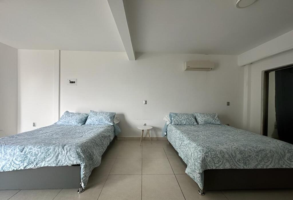 Postel nebo postele na pokoji v ubytování Casa moderna climatizada en Tuxtla Gutiérrez
