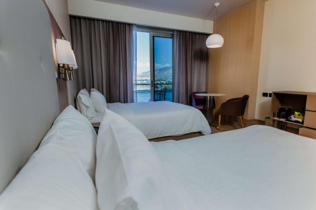 Postel nebo postele na pokoji v ubytování Hilton Garden Inn Silao Aeropuerto Bajio