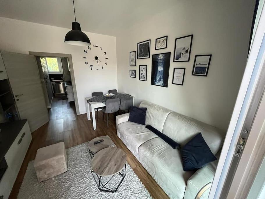 a living room with a couch and a table at New apartment close to the city center! in Milan