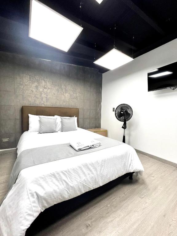 Postel nebo postele na pokoji v ubytování Orbe Hotel Medellín