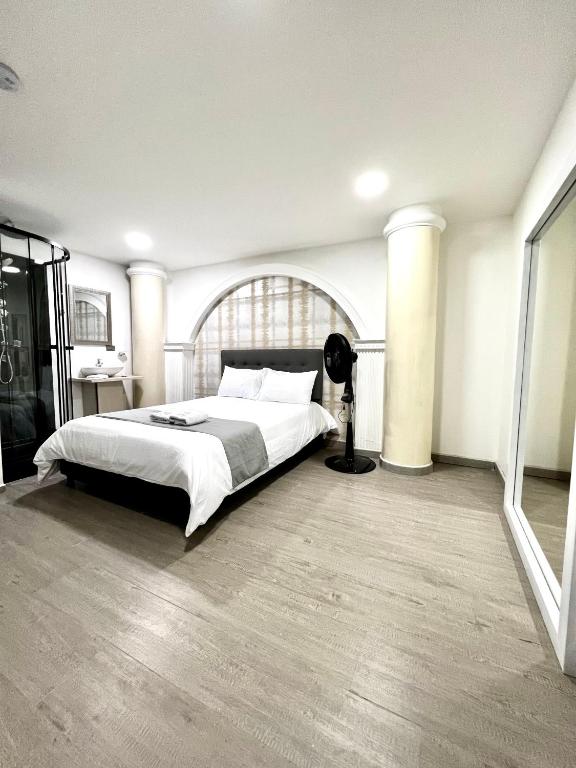 Postel nebo postele na pokoji v ubytování Orbe Hotel Medellín