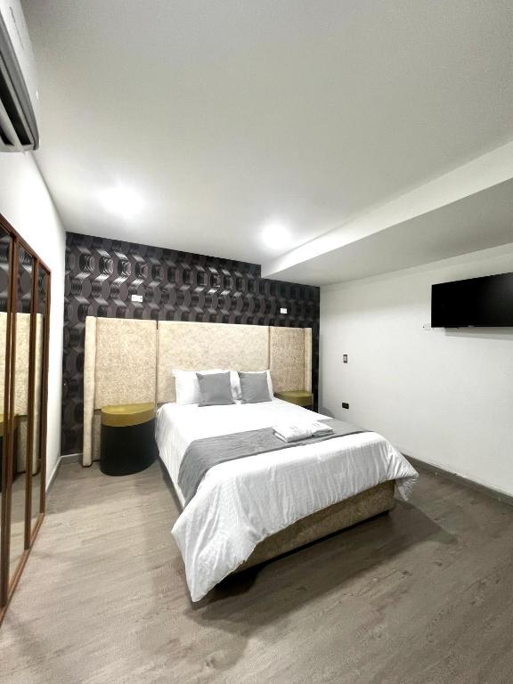Postel nebo postele na pokoji v ubytování Orbe Hotel Medellín