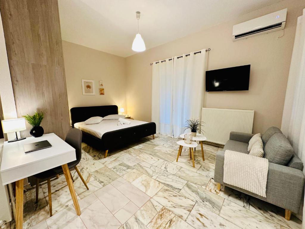 a living room with a bed and a couch at Venetian Gem Central Corfu Retreat in Kanoni