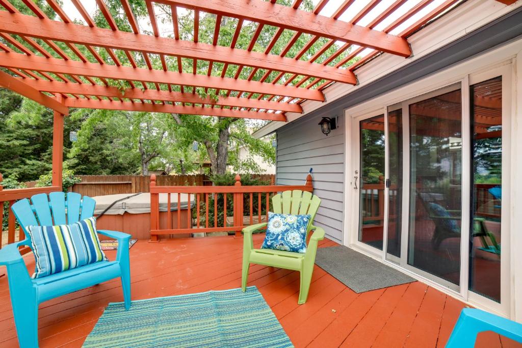a patio with two chairs and a pergola at Pet-Friendly Reno Hideaway with Private Hot Tub! in Reno