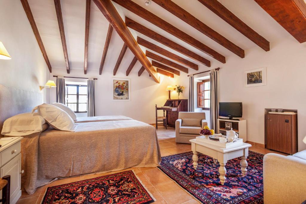 Un ou plusieurs lits dans un hébergement de l'établissement Hotel Llenaire