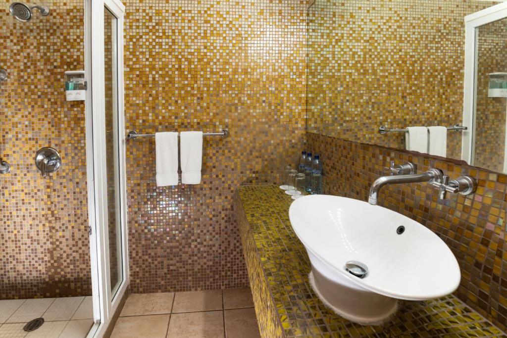 Koupelna v ubytování Hotel Cayman Suites