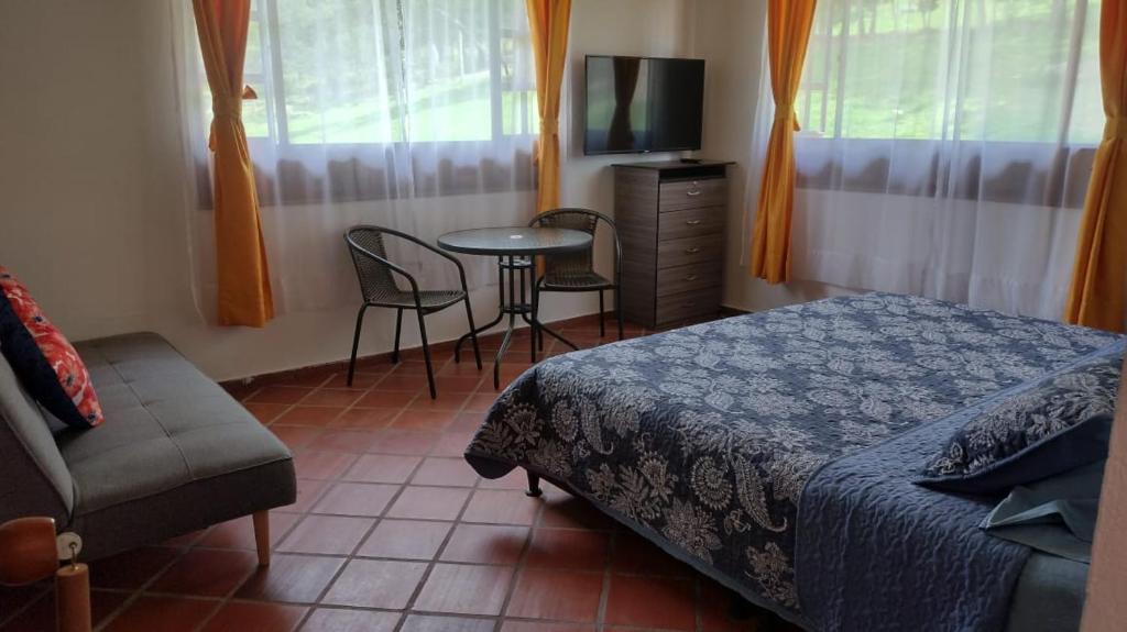 Postel nebo postele na pokoji v ubytování Quinta Los Llanitos Hospedaje Campestre