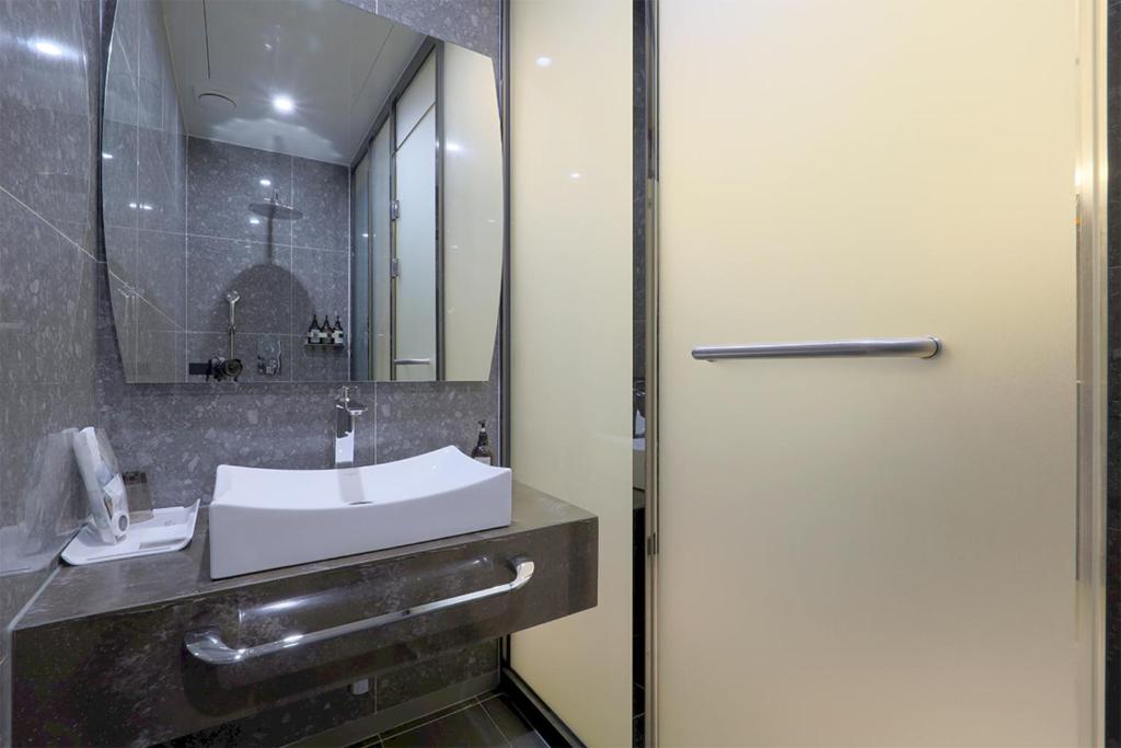 Koupelna v ubytování HOTEL YUNA Business