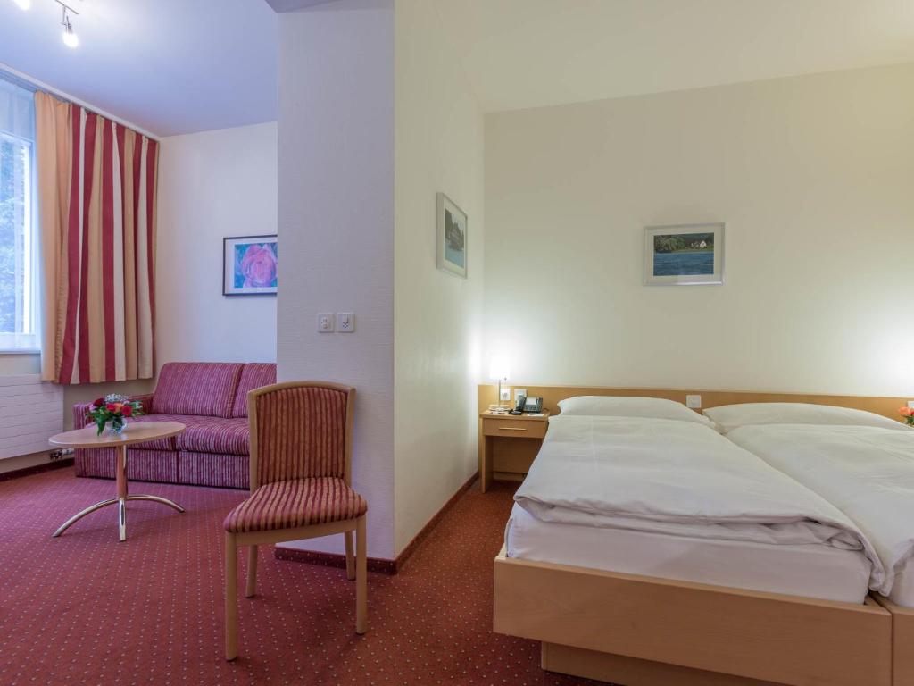 Postel nebo postele na pokoji v ubytování Hotel Promenade