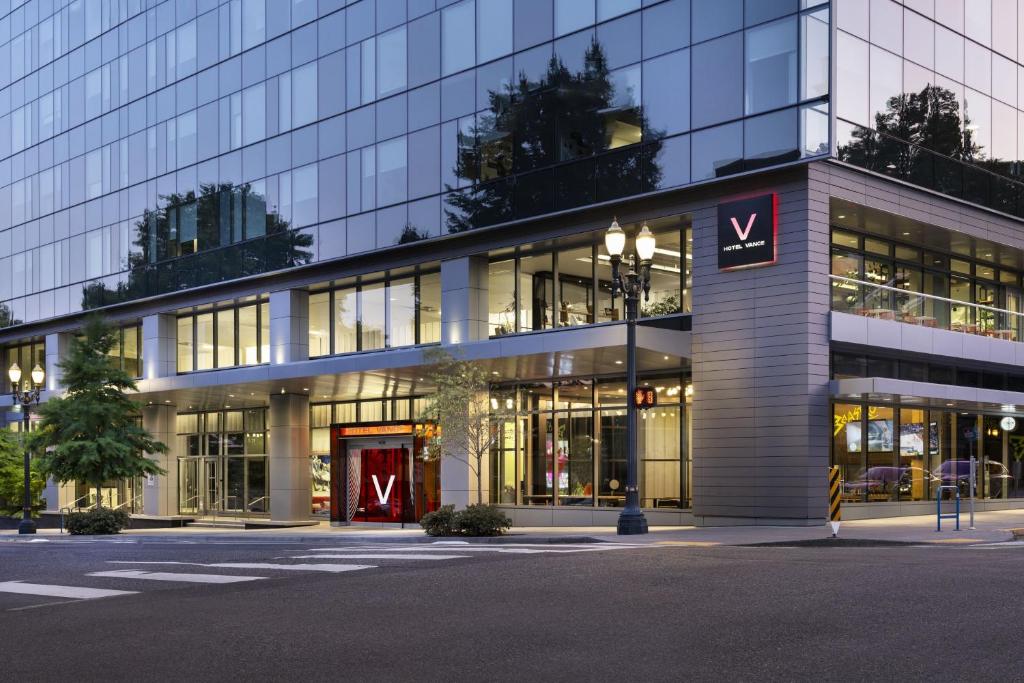 a large building with a sign in front of it at Hotel Vance, Portland, a Tribute Portfolio Hotel in Portland
