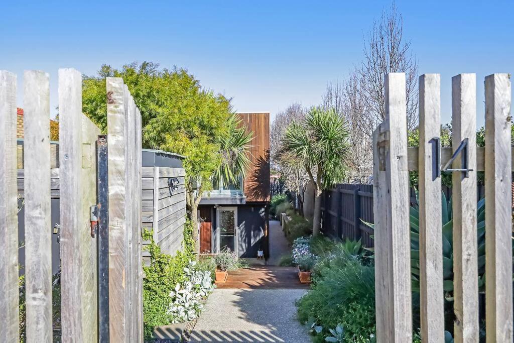 a wooden fence in front of a house at Silver Ball Retreat in Warrnambool