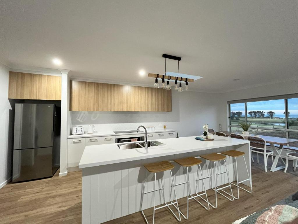 a kitchen with a sink and a counter top at Surrey View in Narrawong