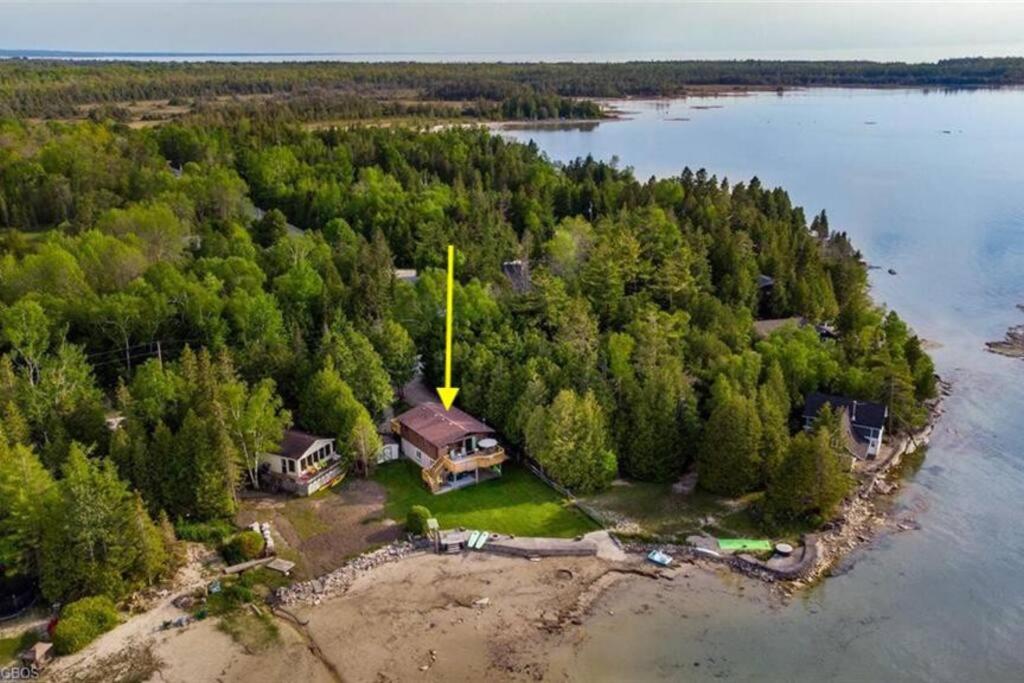 an aerial view of a house on an island in the water at Waterfront Cottage for rent (Near Sauble Beach) in Wiarton