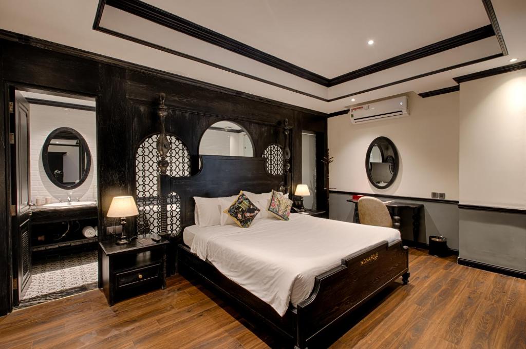 Voodi või voodid majutusasutuse Monarque Hotel Danang toas