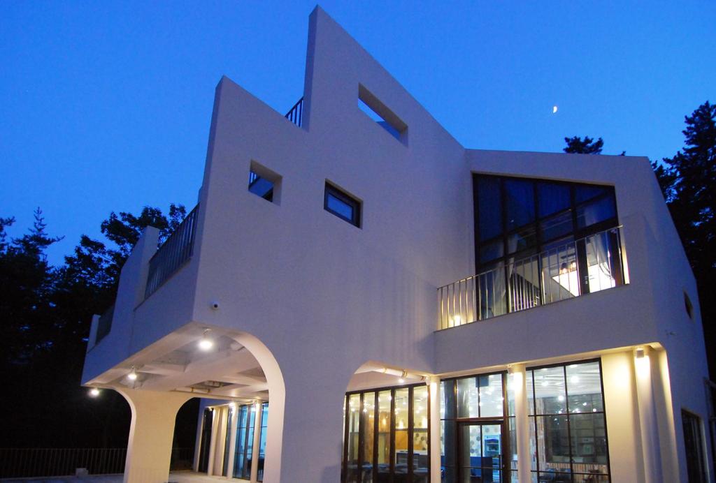 a large white building with a lot of windows at Forestel Meomul in Suncheon