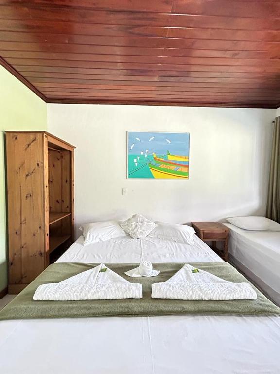 Postel nebo postele na pokoji v ubytování Pousada Paraty Graziela