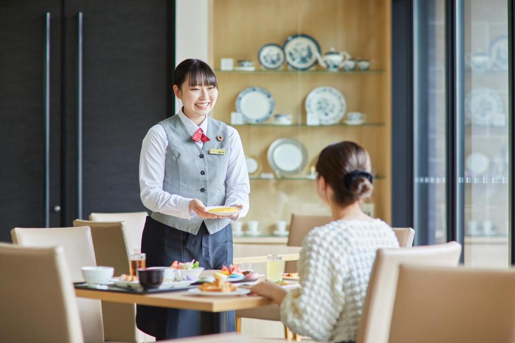Hóspedes ficando em Kanazawa Sainoniwa Hotel