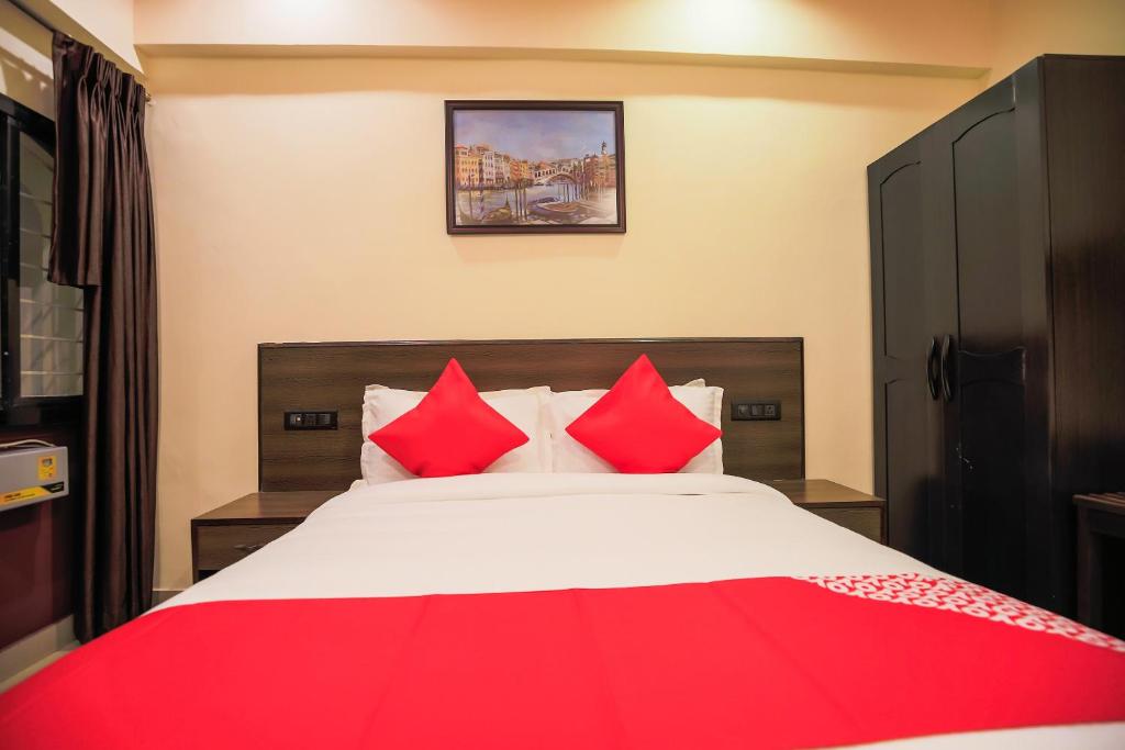 Cama o camas de una habitación en Flagship Near Redikuppam Main Road Near Juhu Beach