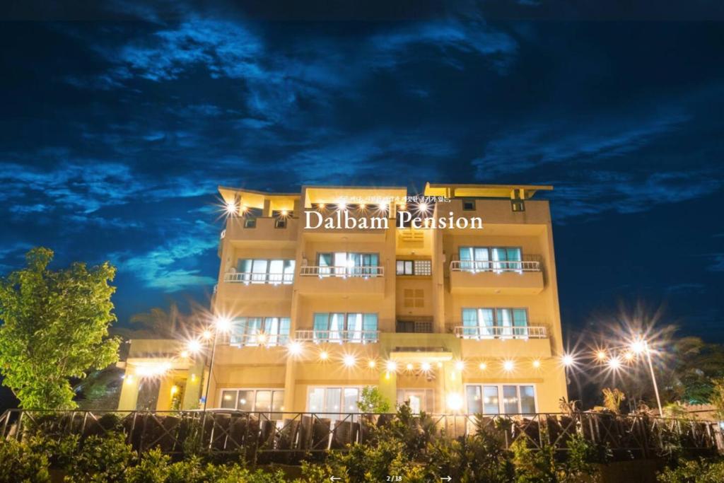 a building with a sign that reads dahlian resort at Jeju Dalbam Pension in Seogwipo