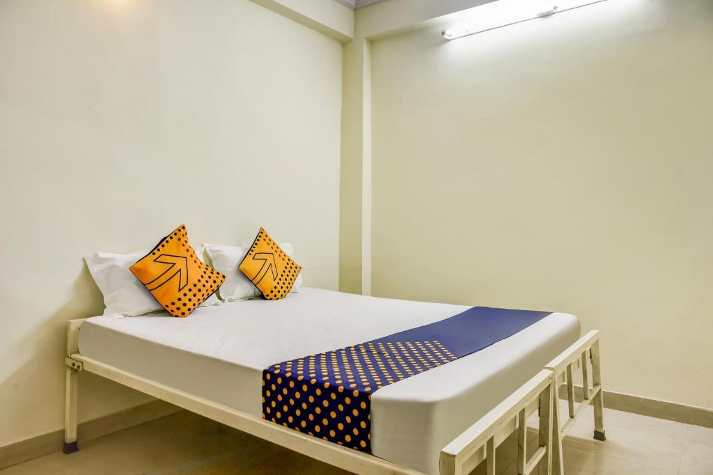 Ліжко або ліжка в номері OYO Hotel Rajwaada Palace