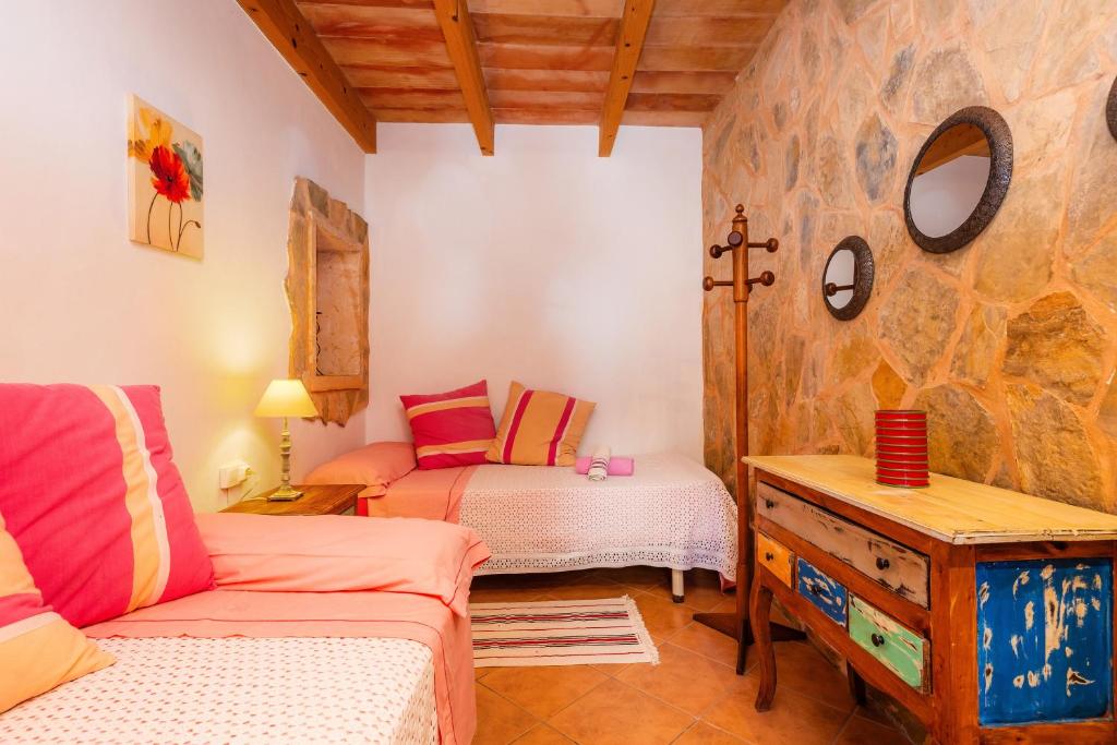 Postel nebo postele na pokoji v ubytování Finca Can Hostalet