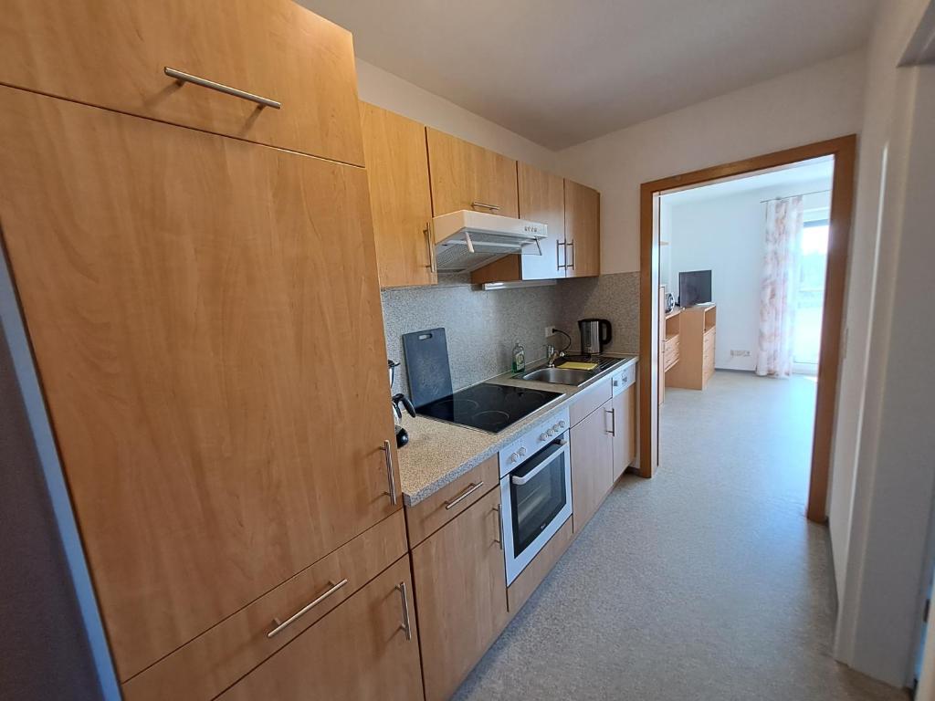 Kuchyň nebo kuchyňský kout v ubytování Ferienwohnung Taubertal Familie Arold