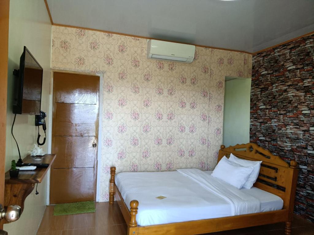 Postel nebo postele na pokoji v ubytování Binalonan Transient/GUESTHOUSE (PENSION GLAYDIE)