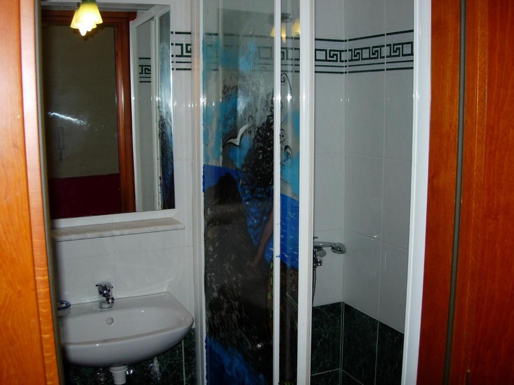 Koupelna v ubytování ALEXANDER Rooms